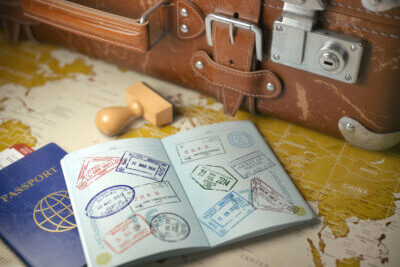 Travel or turism concept.  Old  suitcase  with opened passport w